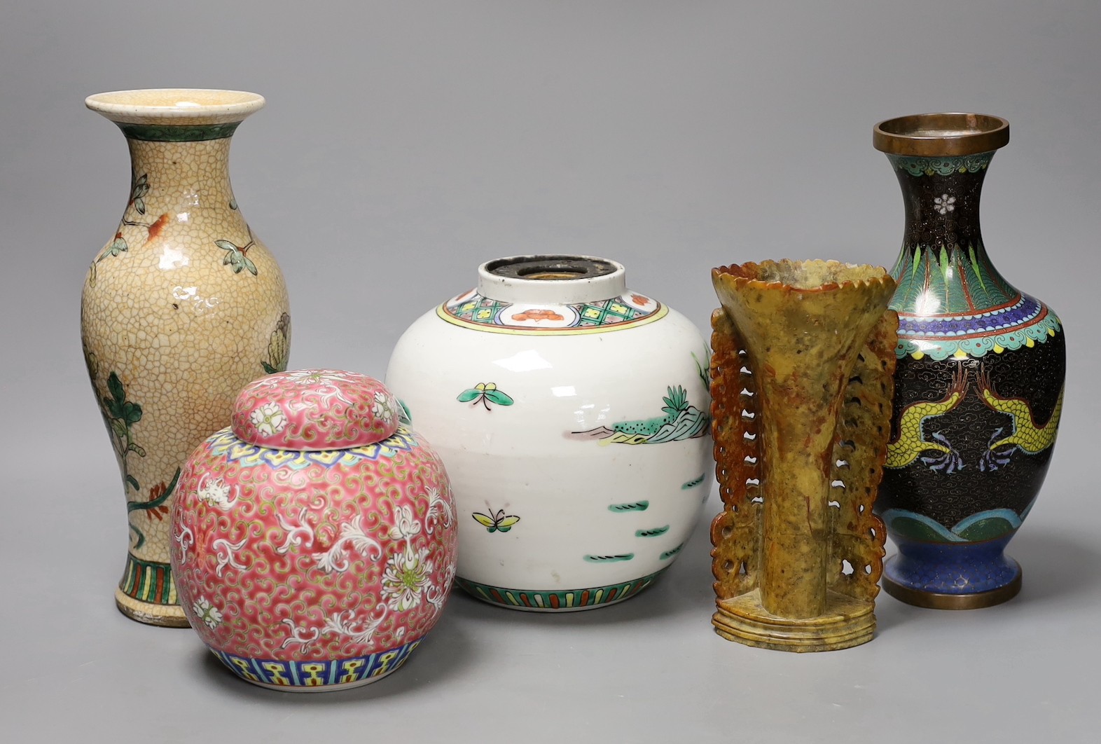 A Chinese famille verte crackle glaze vase, 25 cm high, a famille verte jar, a cloisonné enamel dragon vase, a soapstone vase and an enamelled jar and cover (5)